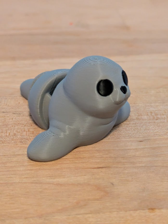 baby manatee keychain